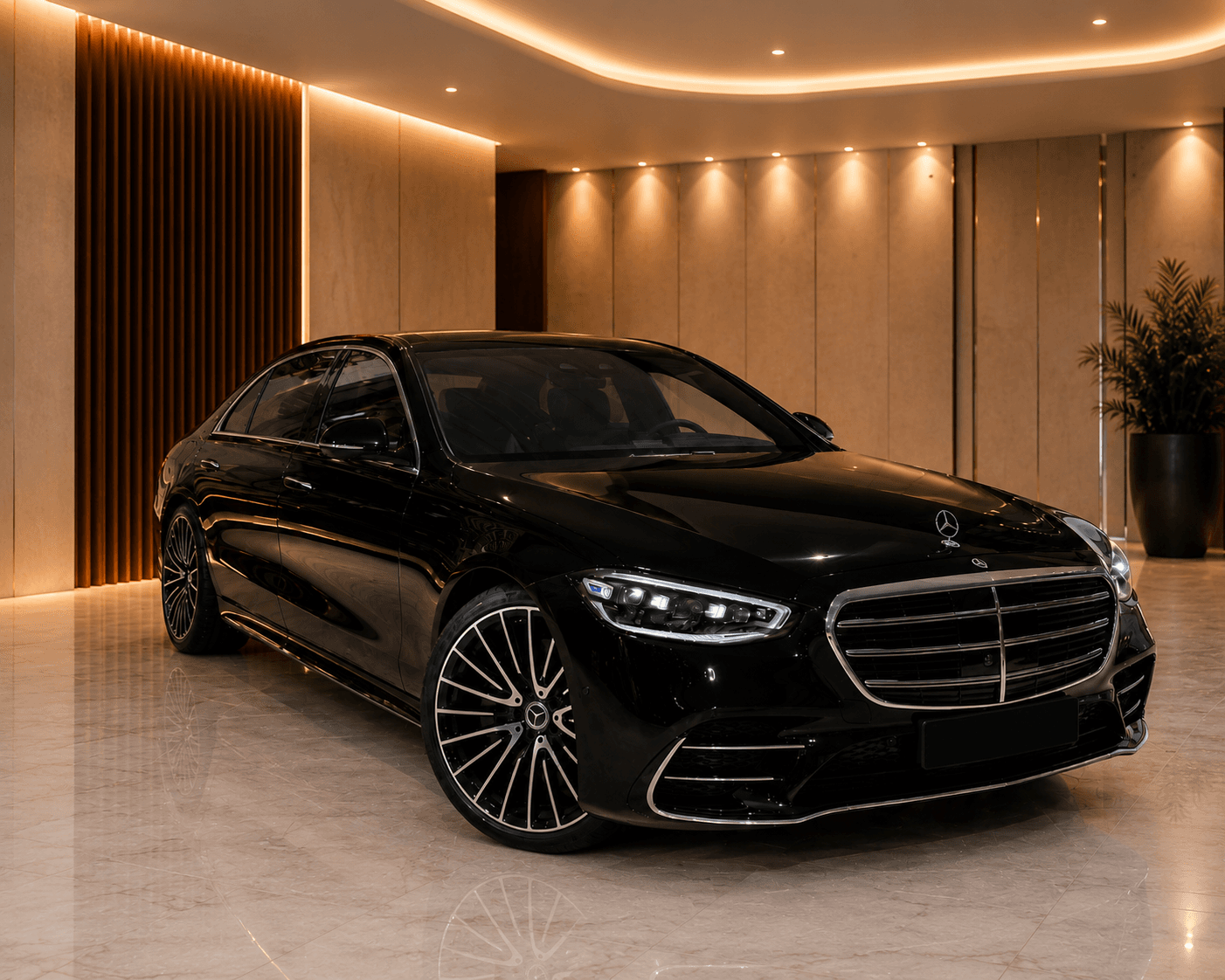 Black Mercedes-Benz S-Class front three-quarter view in a marble-floored showroom