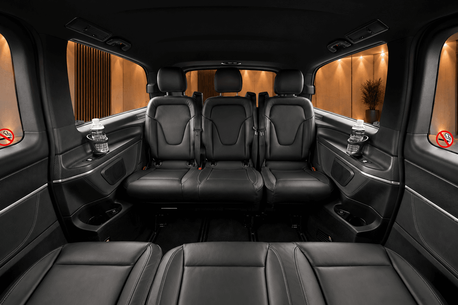 Mercedes V-Class rear passenger seating in black leather with bottled water in the door holders