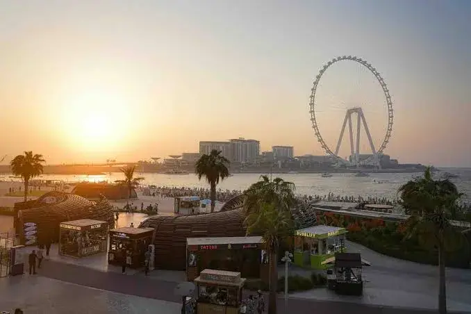 JBR beach at sunset with Ain Dubai observation wheel in the background